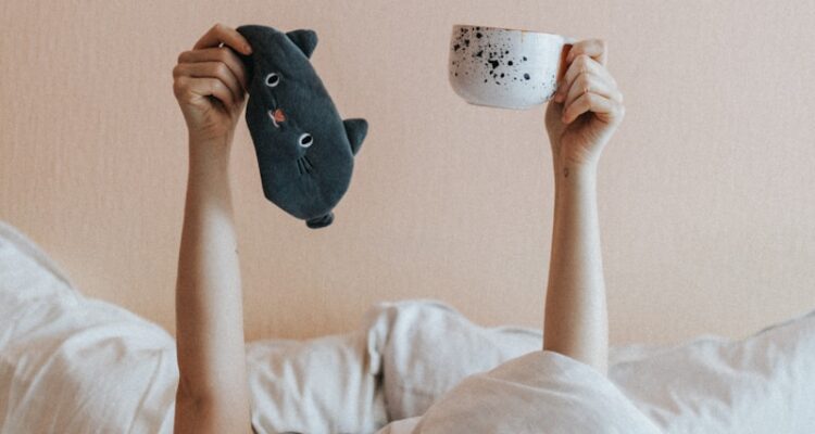 person holding white ceramic mug