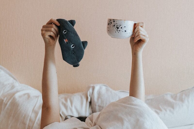 person holding white ceramic mug